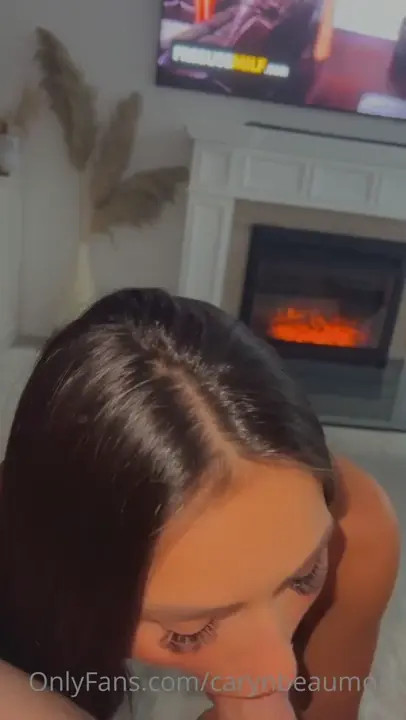 Caryn Beaumont Blows A Cock By The Fireplace