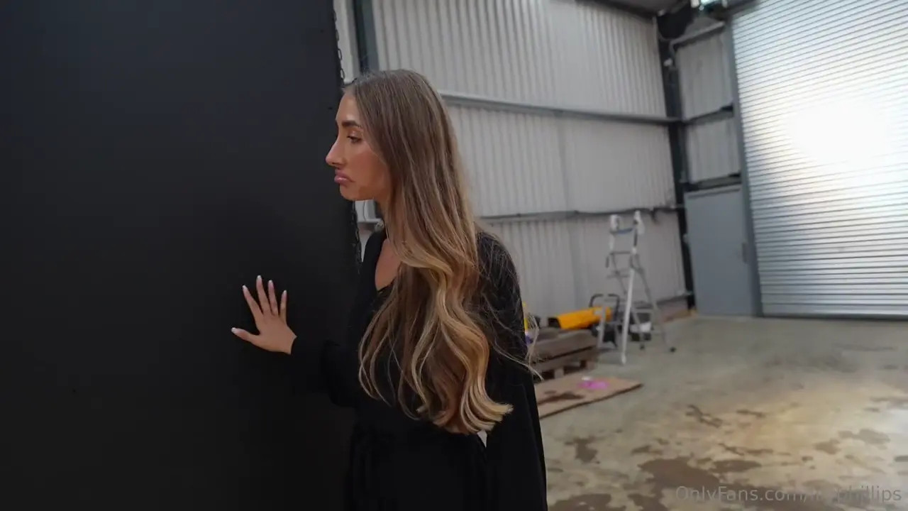 Lily Phillips Enjoys A Gang Bang Through A Glory Hole