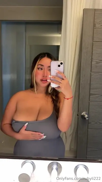 Ruby Li Puts On A Low Cut Dress